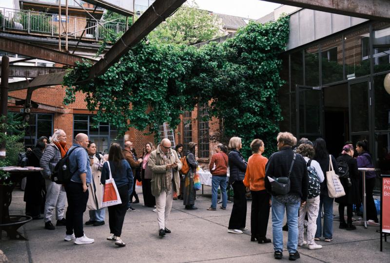 Crowd of people hanging around infront of a venue